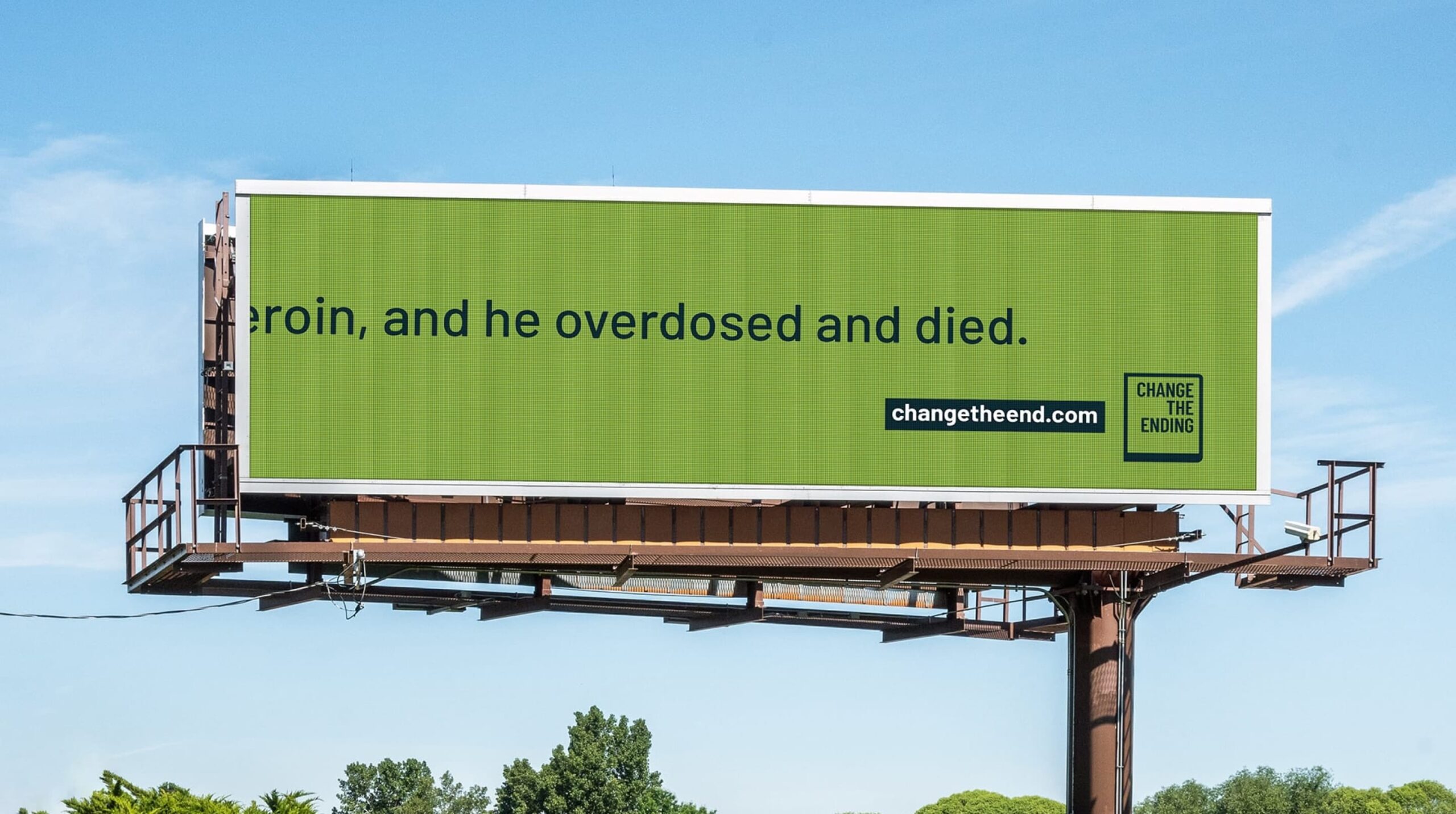 Billboard reading, "(h)eroin, and he overdosed and died: